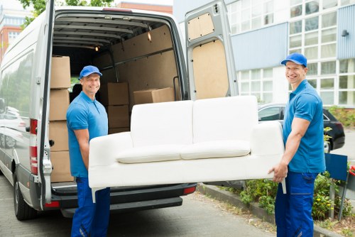 Person moving storage items safely in a well-organised facility