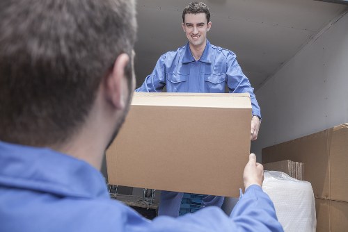 House removals planning in Monkenhadley with moving boxes and a van