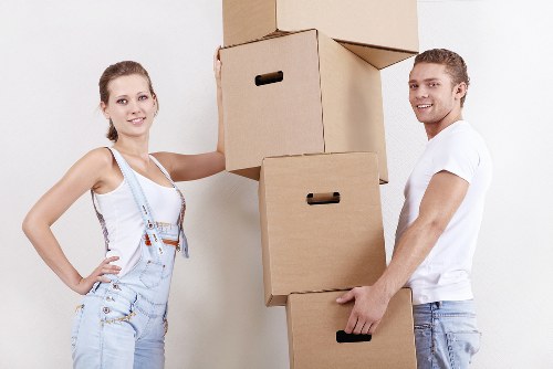 Professional movers handling furniture during house removals in Monkenhadley